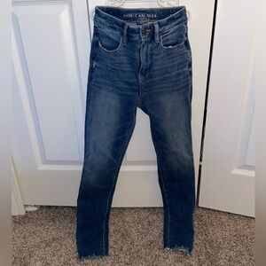 American Eagle Light Wash Distressed Hem Jeans